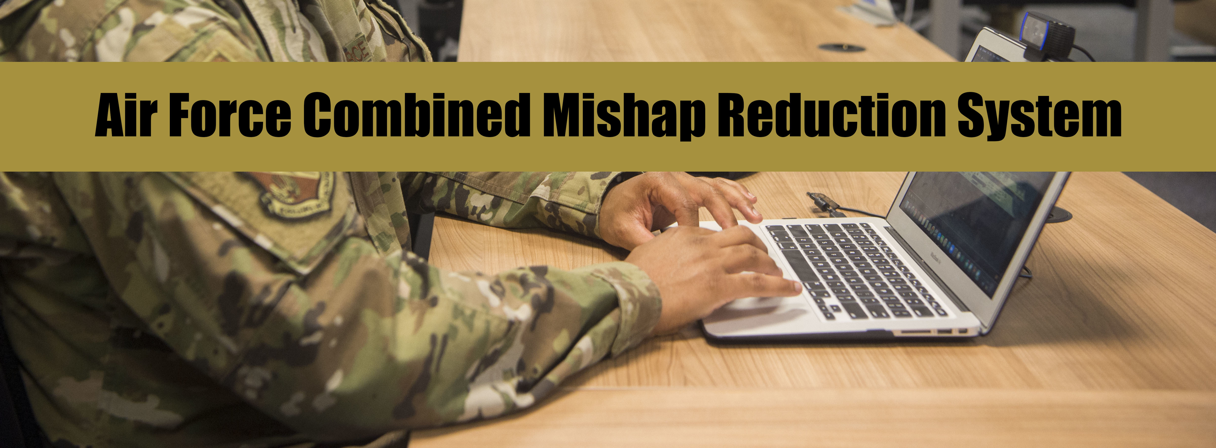 Air Force Combined Mishap Reduction System banner with an image of an Airman typing on a laptop